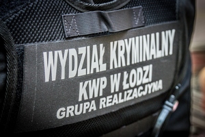 Tył kamizelki taktycznej z napisem: Wydział Kryminalny KWP w Łodzi Grupa Realizacyjna.